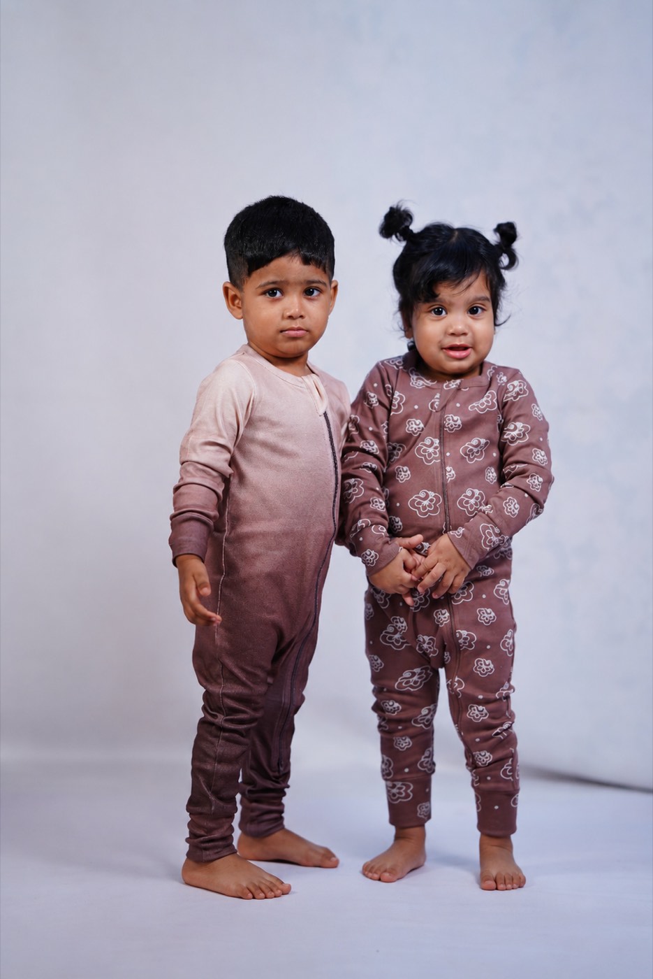 A rail of earthy-toned pieces from the Echoes of Kolam collection