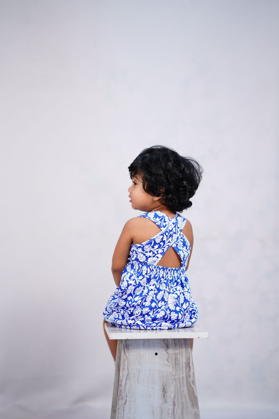 Detail of a naturally dyed organic cotton children's dress by Pangea & Co.